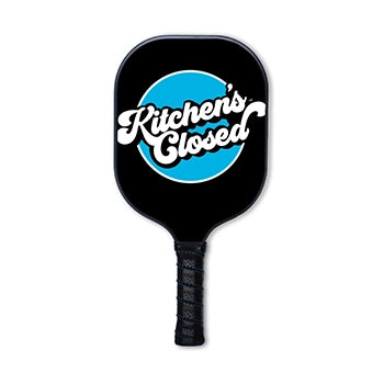 Swinton pickleball paddle with "kitchen's closed" written on it.