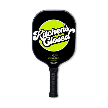 Swinton pickleball paddle with "kitchen's closed" written on it.