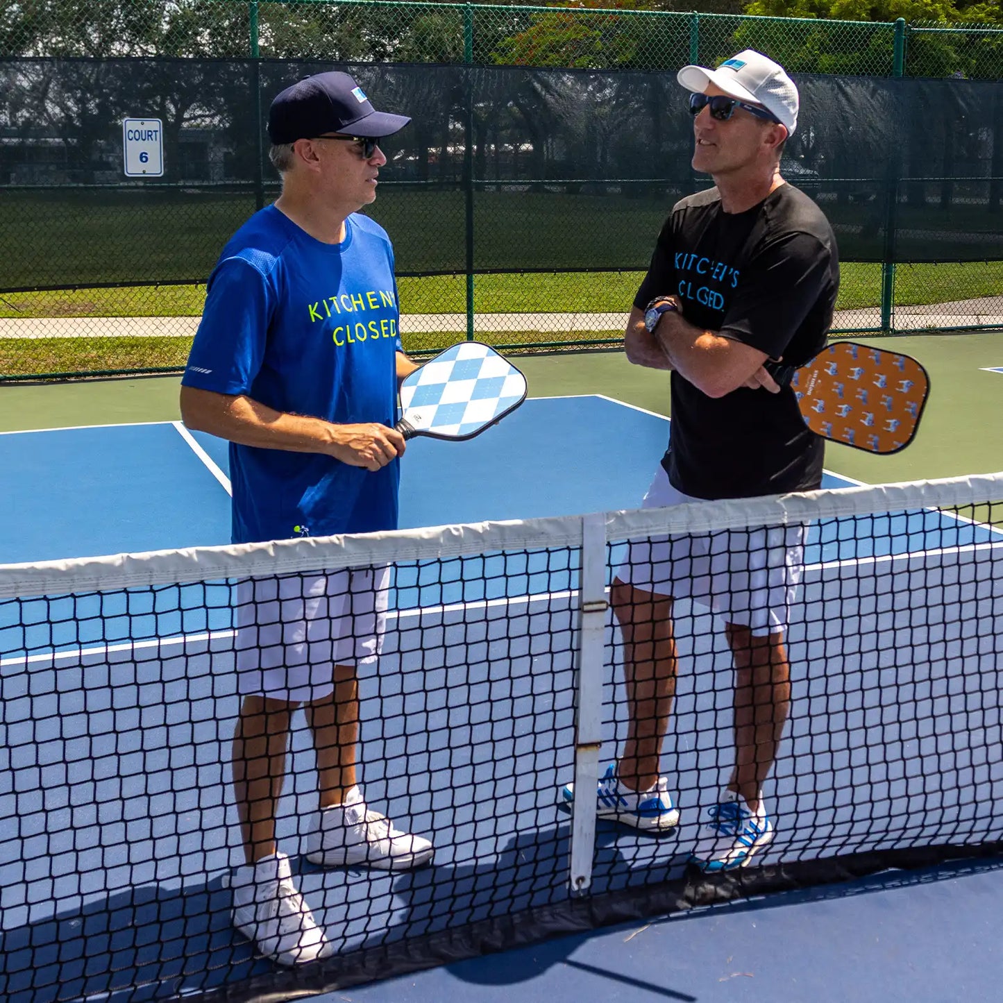 swinton kitchen's closed men's pickleball shirt in royal blue and black