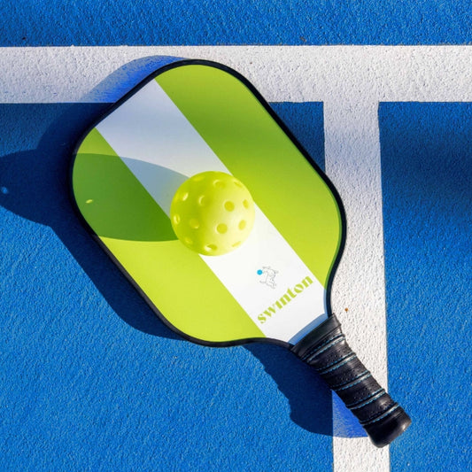 Swinton branded pickleball paddle and ball.