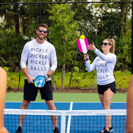 couple playing pickleball with swinton pickleball gear