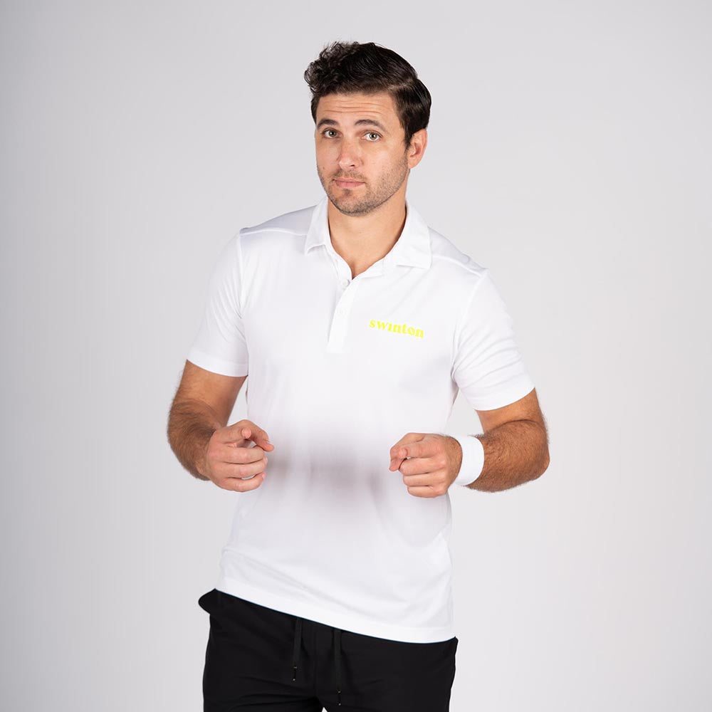 man in front of a white background wearing a swinton pickleball white polo
